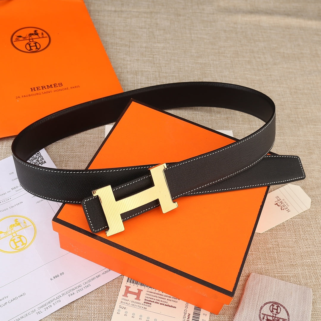 Black leather belt loop with gold H buckle and contrast white topstitching