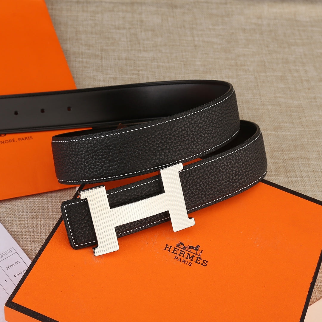 Hermes belt, black textured leather with white contrast stitching and gold H buckle