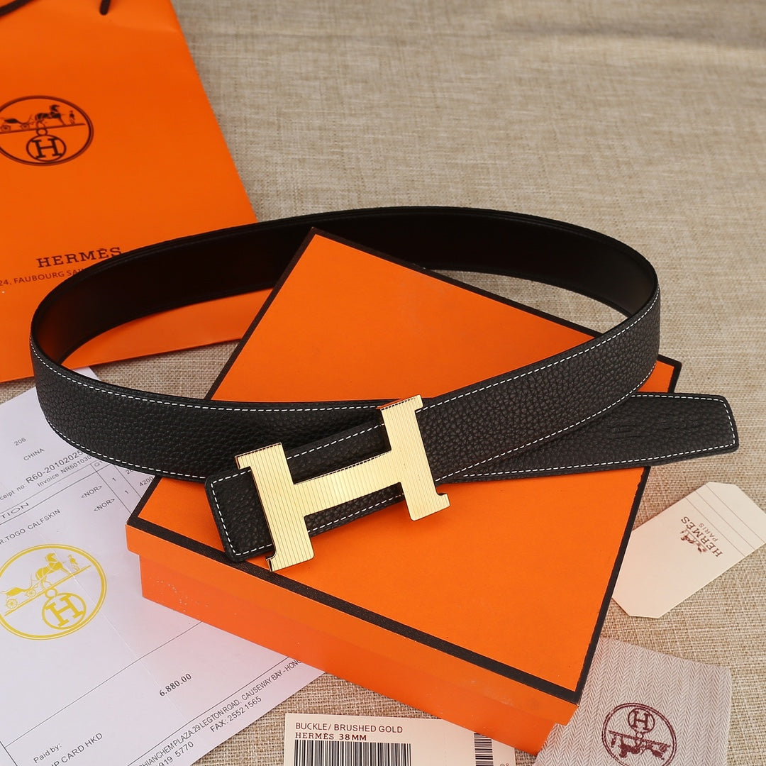 Hermes belt with keeper loop, black textured leather, white stitching, gold H buckle