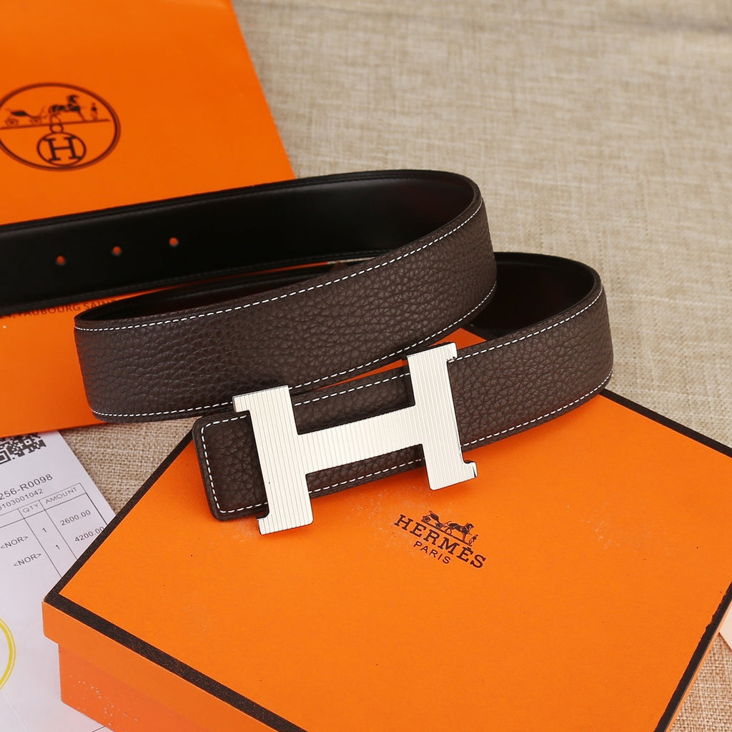 Leather belt with H-shaped buckle, dark brown strap with contrast white edge stitching.