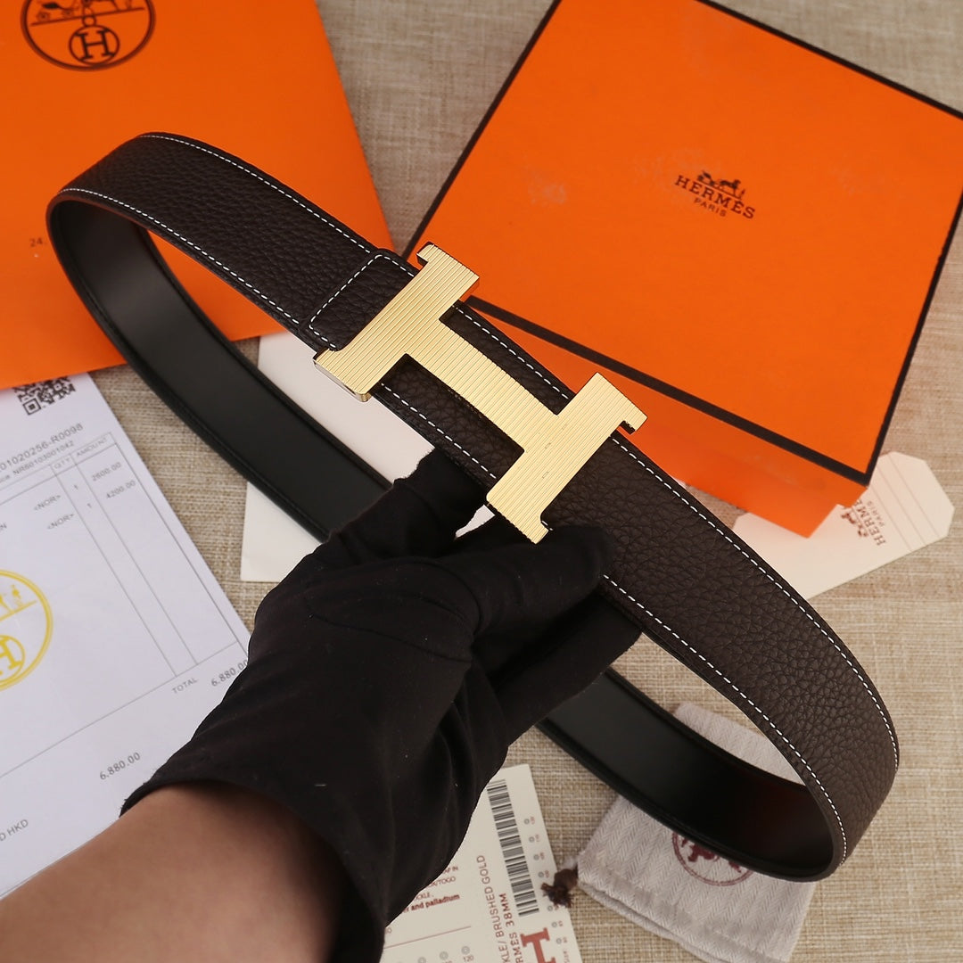 Leather belt with H buckle, dark brown textured leather strap and light gold buckle.