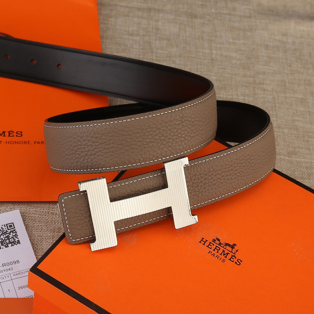 Hermes belt in brown leather with silver-tone H buckle and black underside