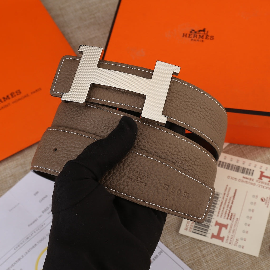 Hermes belt in brown leather with silver-tone H buckle and stitched keeper tab