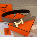 Hermes belt in brown leather with silver-tone H buckle and wide strap profile