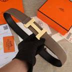 Hermes belt with brown leather strap and silver-tone H buckle with white stitching