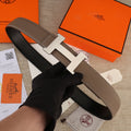 Hermes belt in brown leather with silver-tone H buckle and white contrast stitching