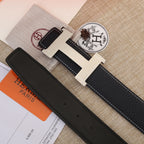 Hermes black leather belt with light gold buckle and stitched edge detail on strap.