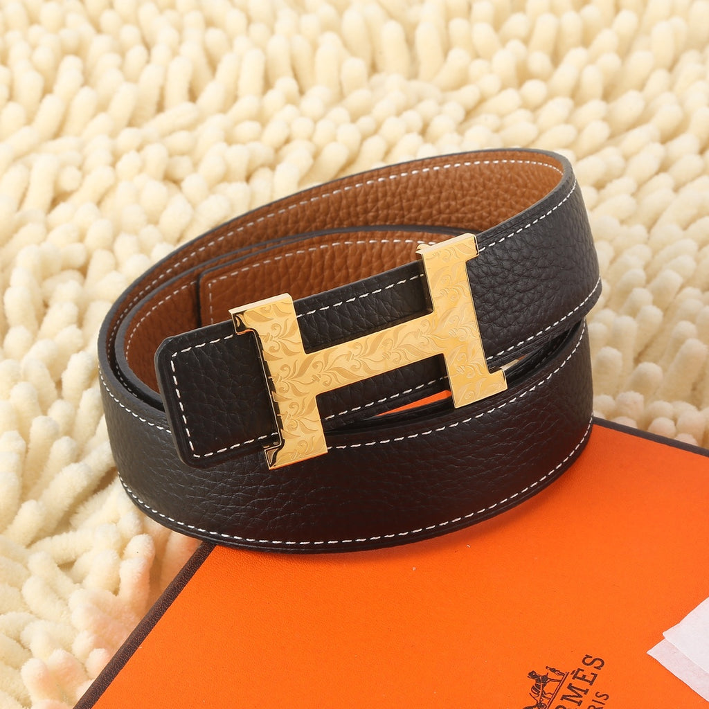 Brown leather belt with gold-tone H buckle, contrast stitching, and dark keeper panel