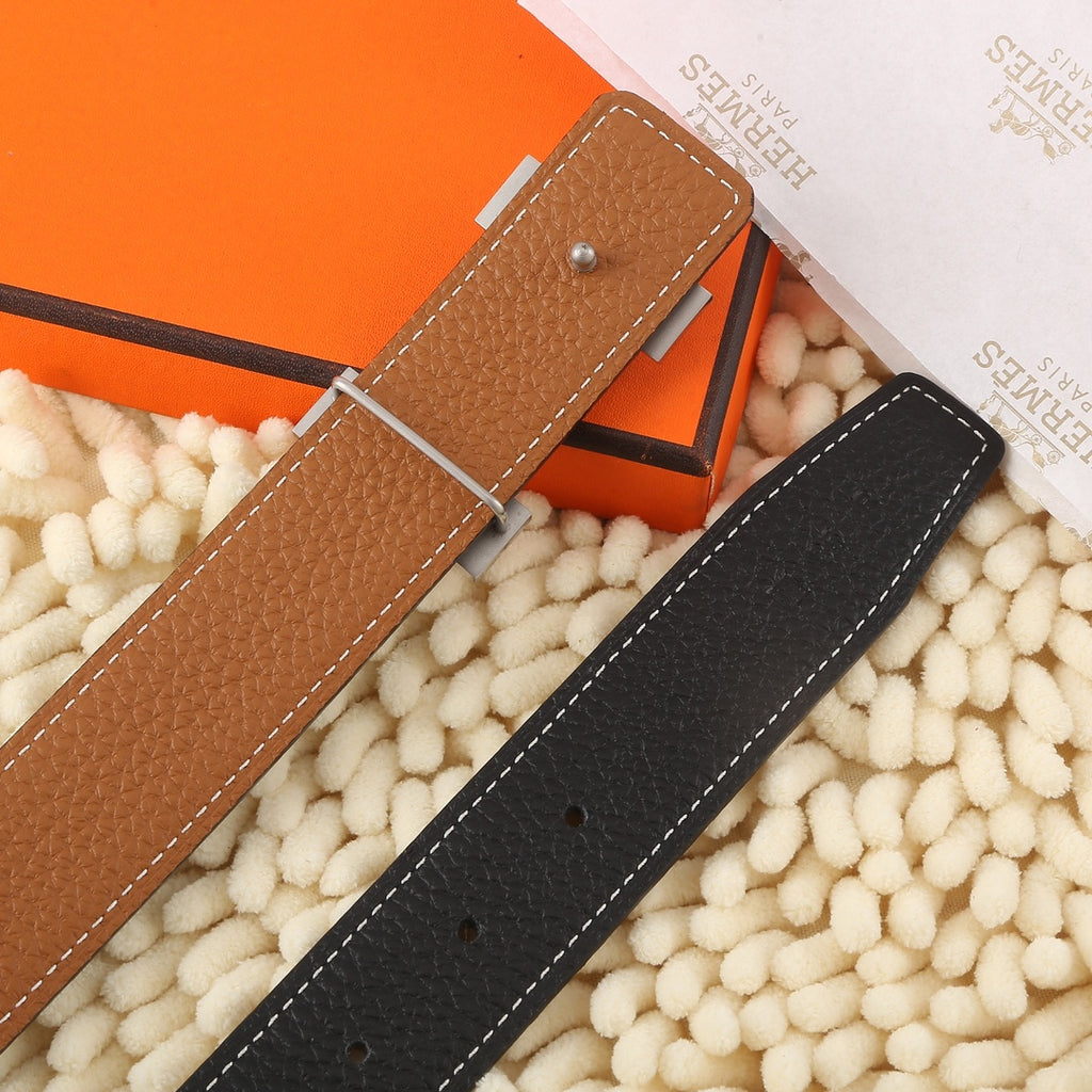 Brown leather belt strap with silver pin and stitched edges, with matching hole pattern