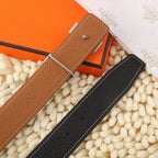 Brown leather belt strap with silver pin and stitched edges, with matching hole pattern