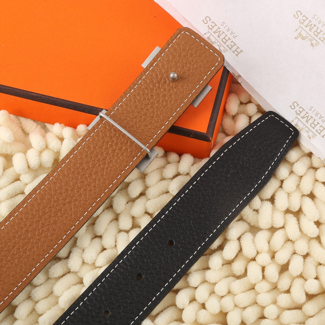 Brown leather belt strap with silver pin and stitched edges, with matching hole pattern