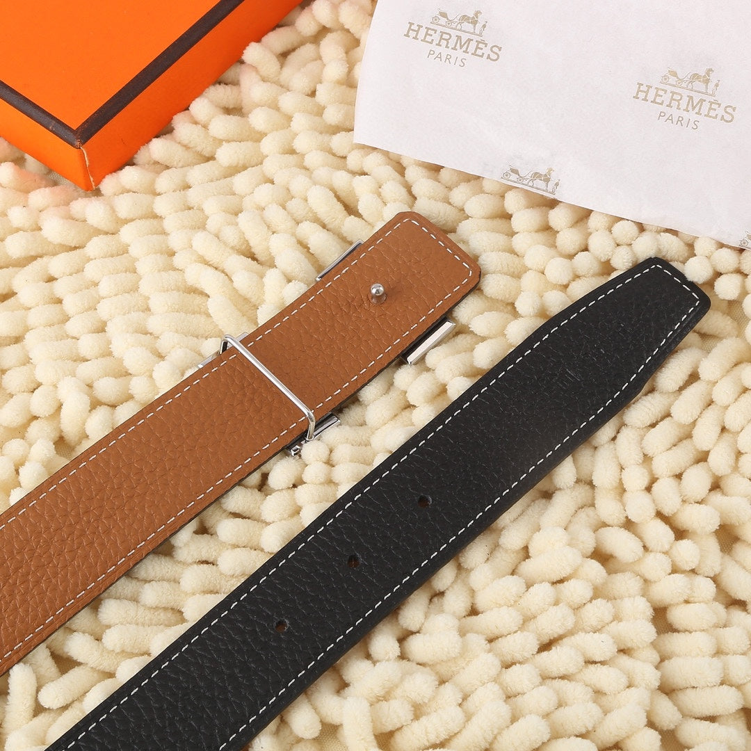 Reversible leather belt: tan and black straps with silver buckle