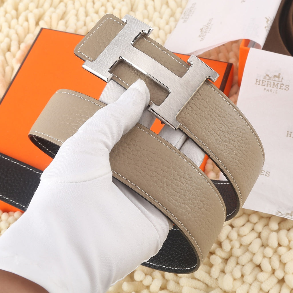 Hermes leather belt, taupe strap with gold H buckle and black lining.