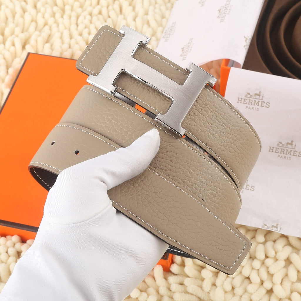 Hermes leather belt, taupe with gold H buckle and rows of stitch lines.