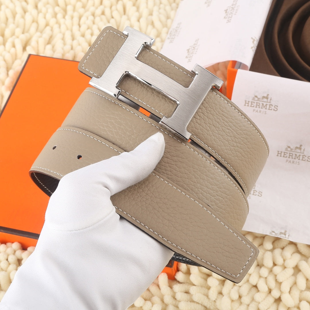 Hermes leather belt, taupe with gold H buckle and rows of stitch lines.