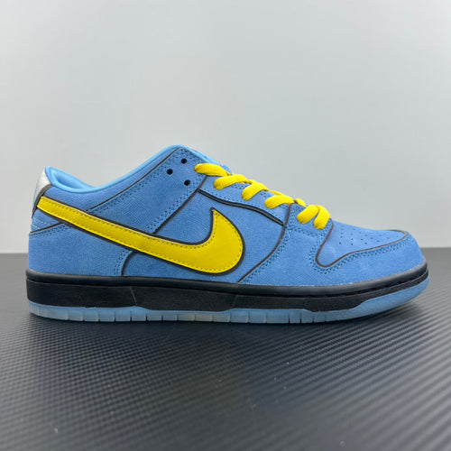 Blue low-top sneaker with yellow Swoosh stripe and yellow lace-up front