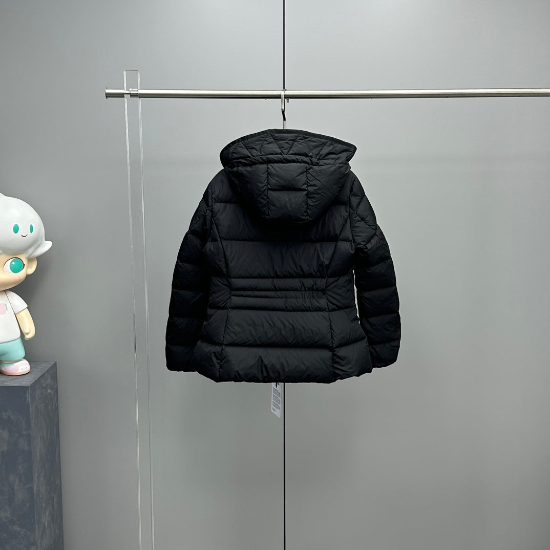 Dark hooded long puffer jacket on hanger with quilted front