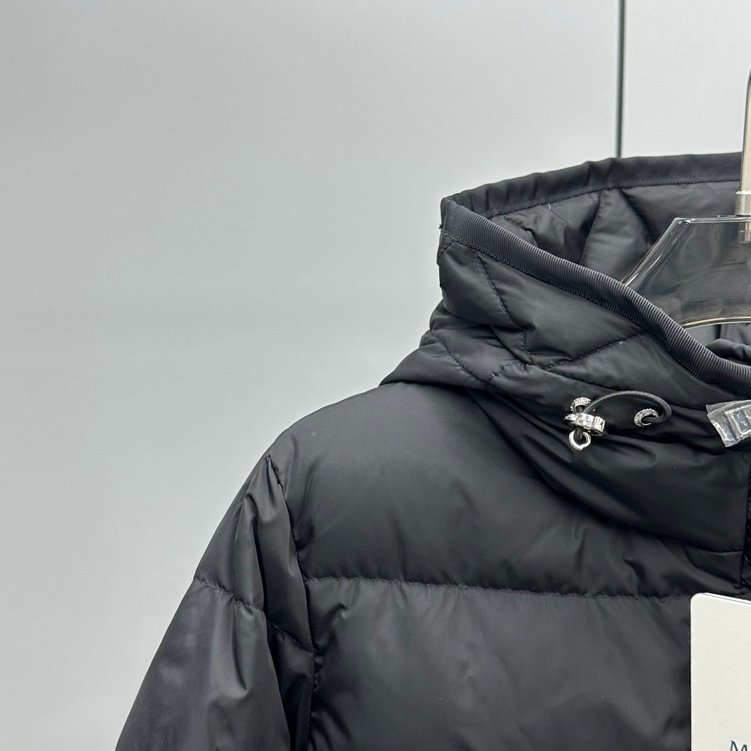 Dark hooded puffer jacket with drawstring hood and zipper front