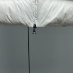 Moncler white puffer jacket close-up of front zipper and black pull tab