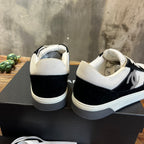 Chanel unisex sneakers rear view with black heel panels and white back tabs