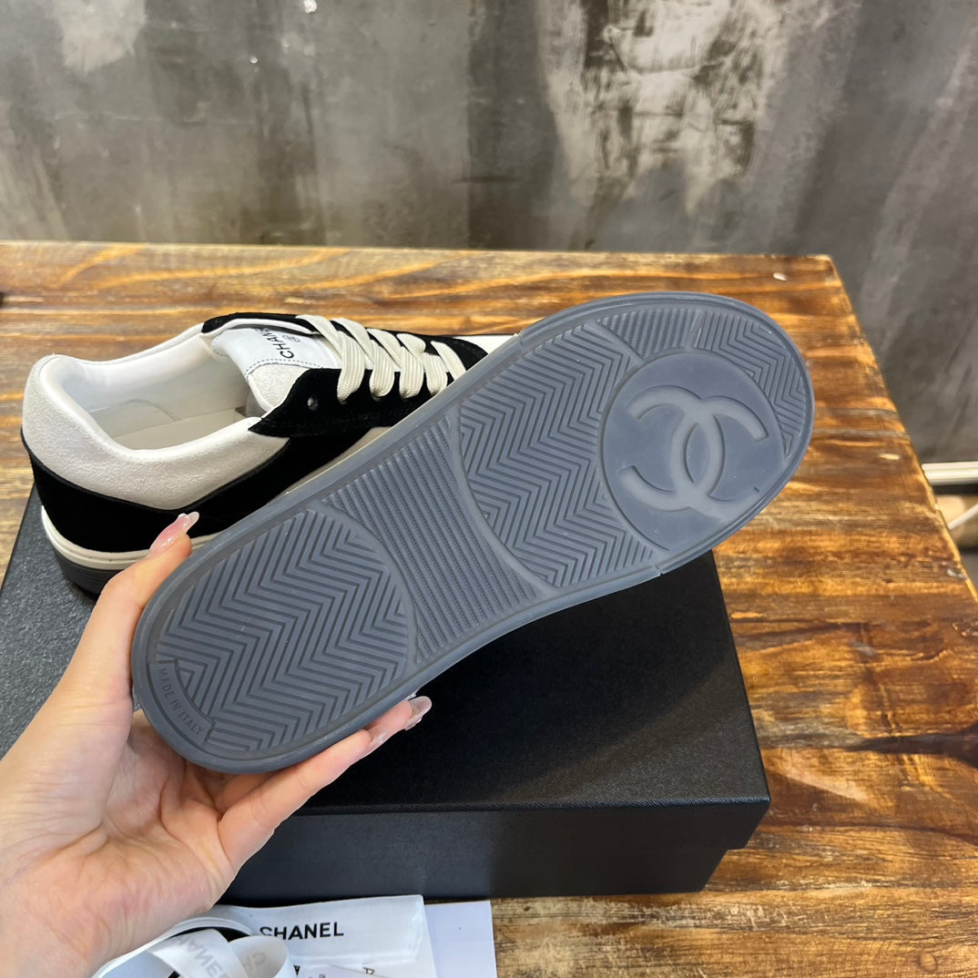 Chanel unisex sneakers outsole view in gray rubber with tread pattern and CC emblem