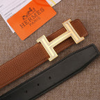 Brown leather belt with silver-tone H buckle and dark keeper strap
