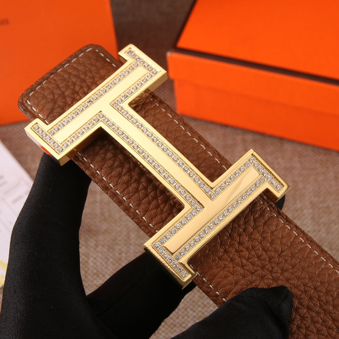 Brown leather belt with large H buckle in silver-tone with gem-like trim