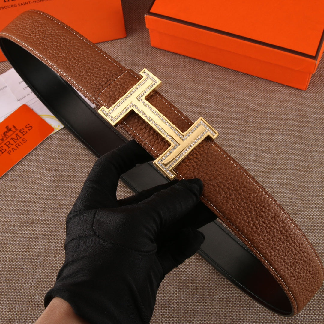 Brown leather belt with studded H buckle and gold-tone metal frame