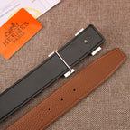 Two leather belts, black and brown, each with silver-tone buckle and keeper tab