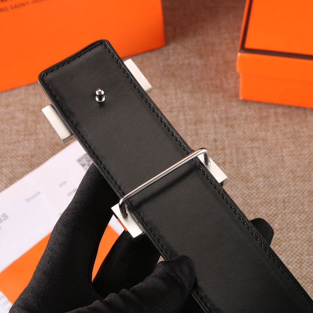 Black leather belt with metal buckle frame and adjustable bar