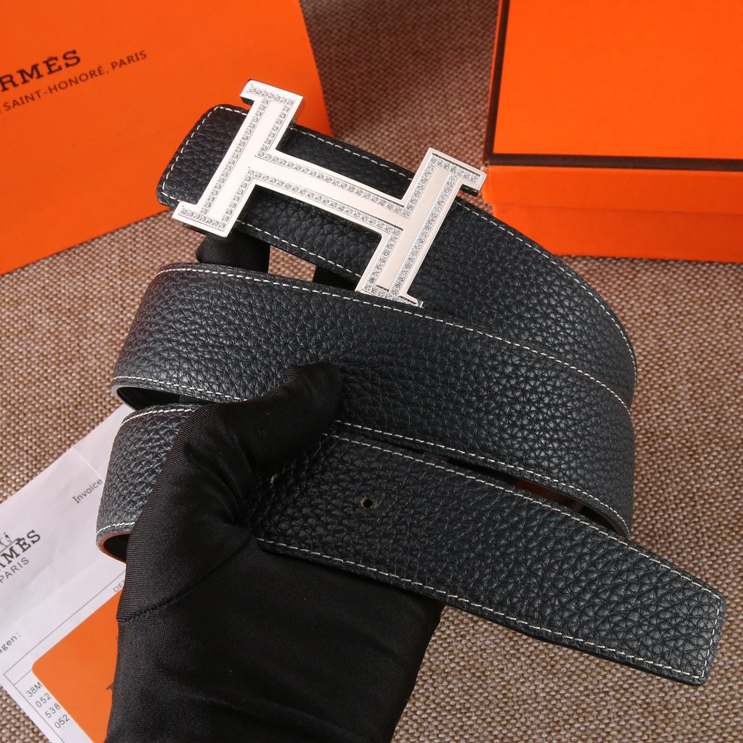 Black leather belt with stitched strap and metal clasp hardware