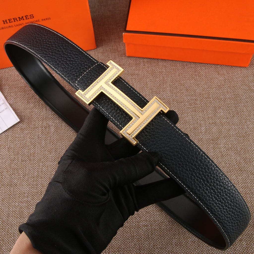 Black leather belt with textured finish and gold-tone H buckle