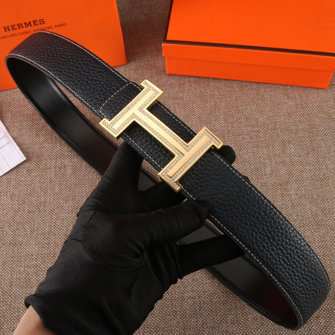Black leather belt with textured finish and gold-tone H buckle