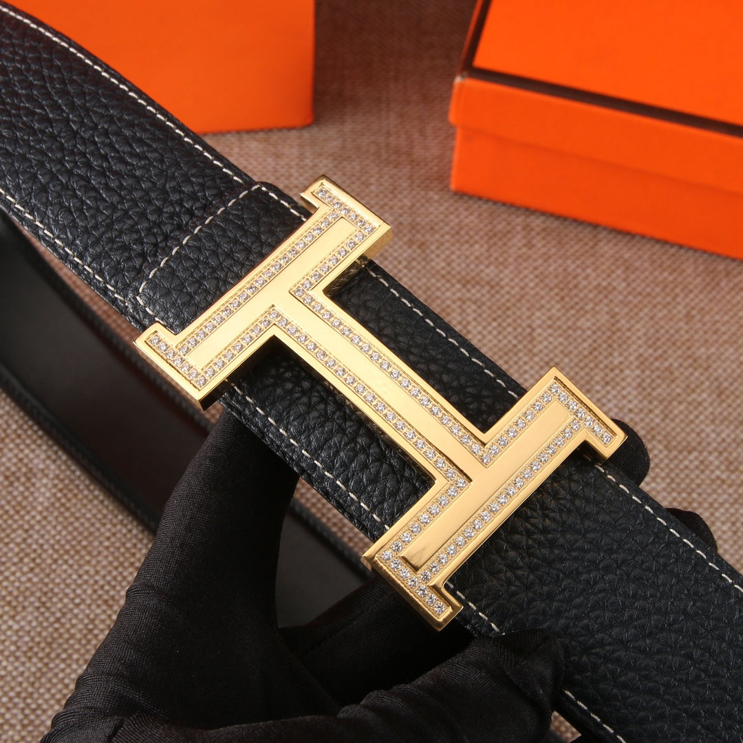 Black leather belt with large gold-tone H buckle detail