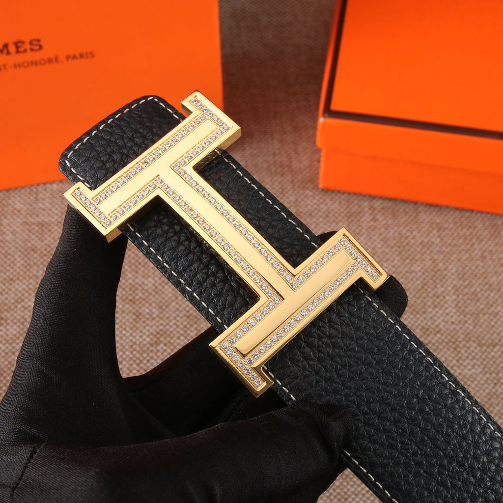 Black leather belt with oversized gold-tone H buckle and edge stitching