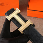Black leather belt with oversized gold-tone H buckle and edge stitching