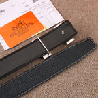 Black leather belt with silver-tone buckle and adjustment holes