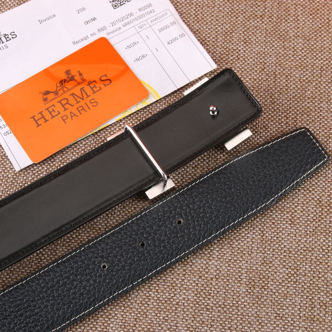 Black leather belt with silver-tone buckle and adjustment holes