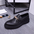 Versace luxury loafers in black, textured upper with gold buckle strap