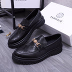 Versace luxury loafers, black with textured leather and gold buckle strap