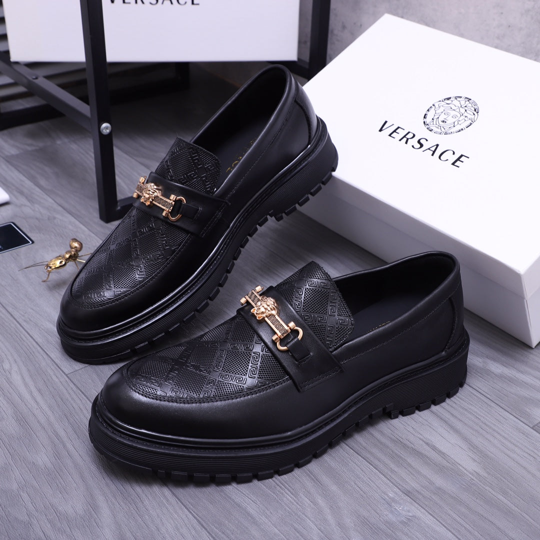 Versace luxury loafers, black with textured leather and gold buckle strap