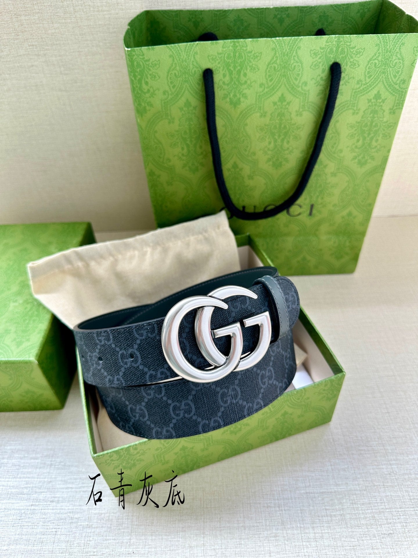 Gucci belt in box: dark blue monogram leather with silver-tone GG buckle