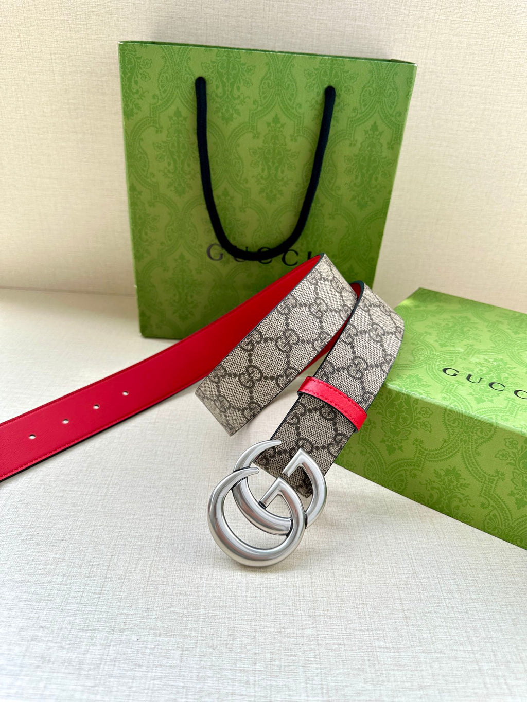 Gucci GG canvas belt with red leather edge and silver double-G buckle