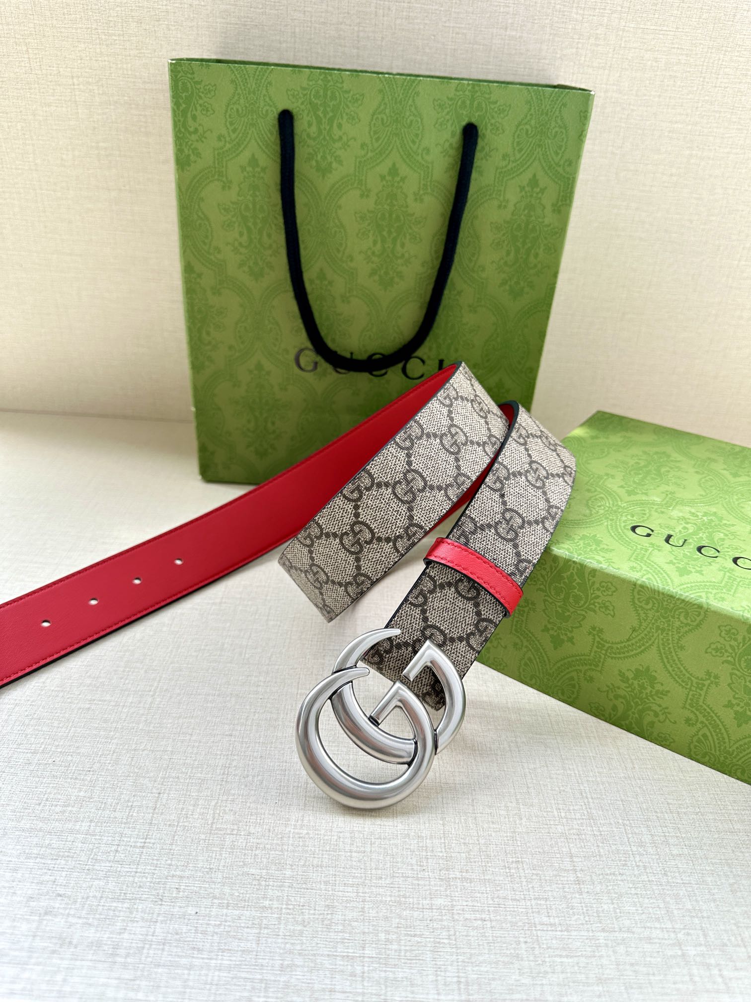 Gucci GG canvas belt with red leather edge and silver double-G buckle