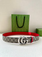 Gucci GG canvas belt with red trim and silver double-G buckle