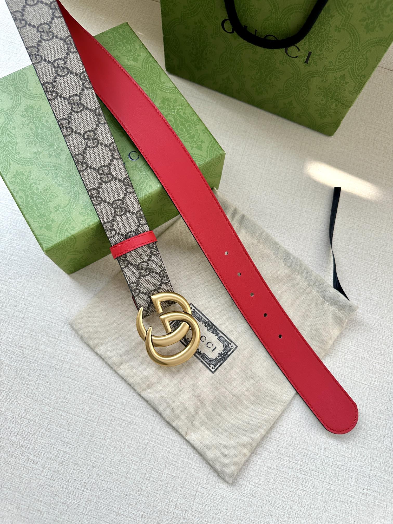 Gucci GG canvas belt with red strap and gold interlocking double-G buckle