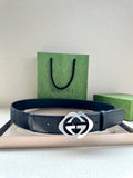 Gucci leather belt in dark navy with round GG logo buckle, silver-tone ring