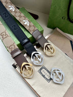 Gucci belt set with GG canvas straps and logo buckles in tan, navy, brown.