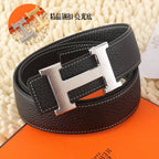 Black leather belt, silver-tone buckle, side view, stitched strap