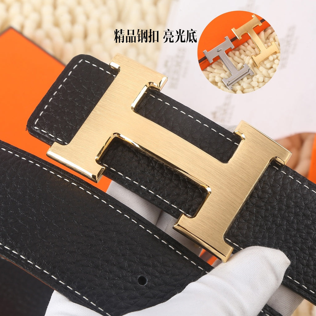 Black leather belt, gold-tone buckle, textured grain, close-up